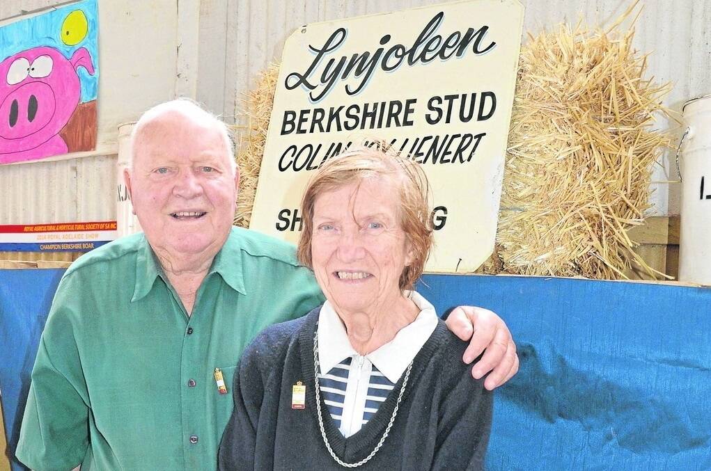 BOWING OUT: Colin and Joy Lienert in the pig shed in their 58th and final year of showing Berkshires at Royal Adelaide.