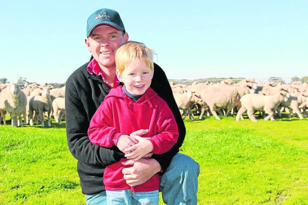VALUE CHAIN: Nick Malone, pictured with his son Thomas in front of some of the family’s production ewes and their lambs, is proud of the Malone Lamb success at the recent Sydney Fine Food Awards, trusting it will help all the vital players in the product chain they have established.