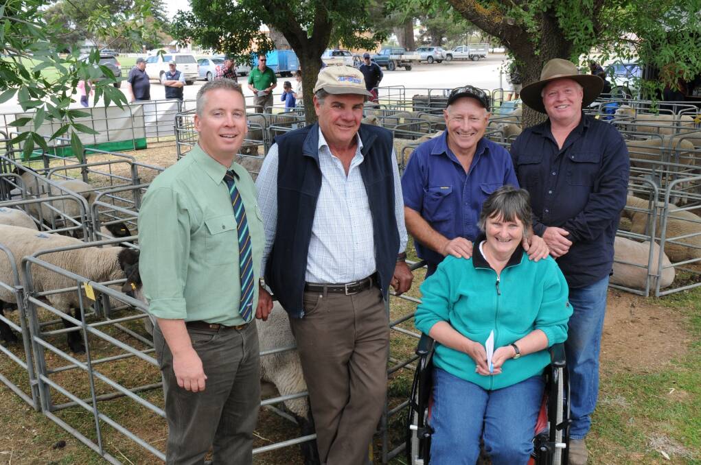VOLUME BUYER: Landmark auctioneer Gordon Wood with volume buyer Peter Dunn, Cominella, at Strathalbyn, vendors Wendy and Colin Wilson, Loch Sloy, and Roland Floyd from Maydale. He bought five rams from Loch Sloy, two from Maydale and also purchased a ram from the Pebblestone stud.