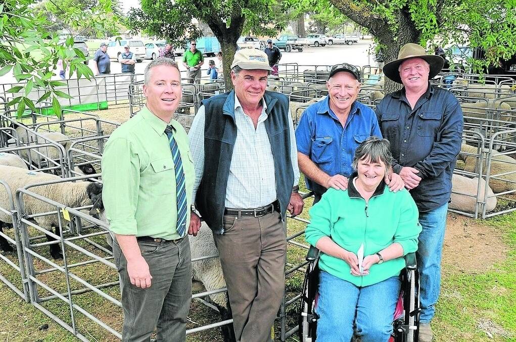 VOLUME BUYER: Landmark auctioneer Gordon Wood with volume buyer Peter Dunn, Cominella, Strathalbyn, vendors Wendy and Colin Wilson, Loch Sloy, from whom Peter bought five rams, and Roland Floyd, Maydale stud, who sold two rams to him. He also bought a ram from the Pebblestone stud.
