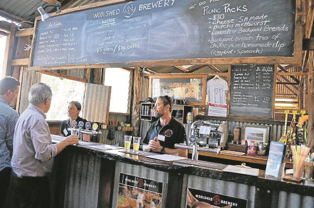 IN ACTION:  Wilkadene Woolshed Brewery owner Tom Freeman, Murtho, and his partner Sarah Dowdell serve customers at the brewery.