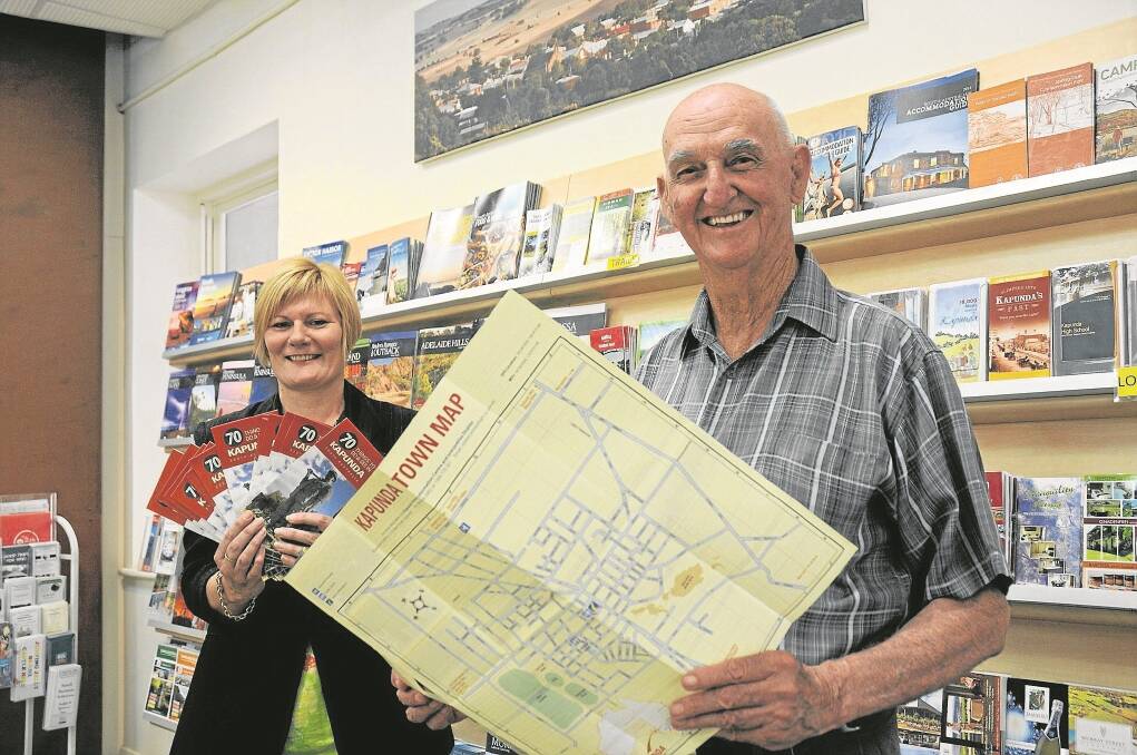 Kapunda Business Alliance working party member Sonia Fowler and the alliance's secretary and treasurer Bill Adams show off the new glossy brochure that lists 70 things to do and see in town. 