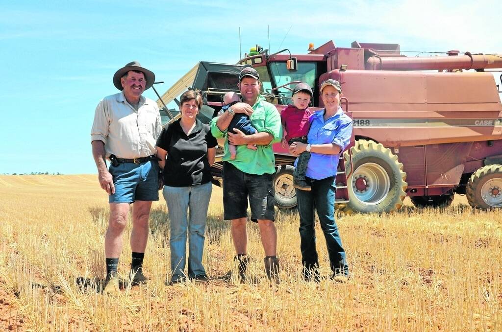 CROP FALLBACK: Greg and Dianne Pollard with their son Ben, his wife Lee and grandchildren Sonny and Cody. To manage risks in international markets, the Pollards have diversified into cropping.