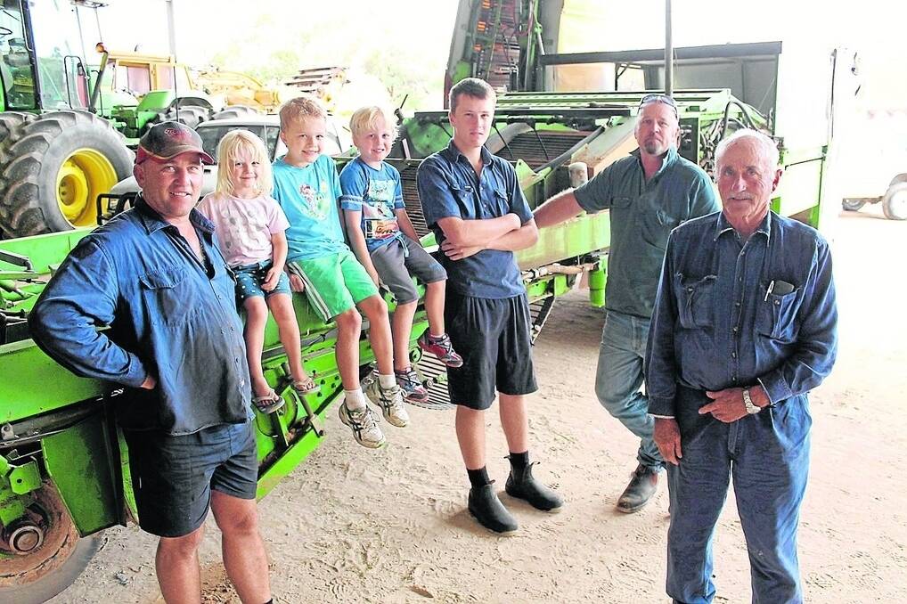 FAMILY AFFAIR: Three generations will help out with the upcoming potato harvest at Morrells Pastoral - Owen Morrell (right) with sons Kingsley and Ashley, and their kids Logan, 3, Bailey, 8, Ethan, 6, and Riley, 17. The family has farmed the Bowhill property for the past 100 years.