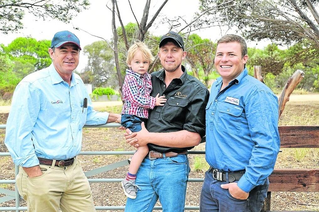 GENETIC BOOST: Bruce and Jonny Arkins, Genomix, with Raven Limousin’s Jason Schulz (holding his son Heston).