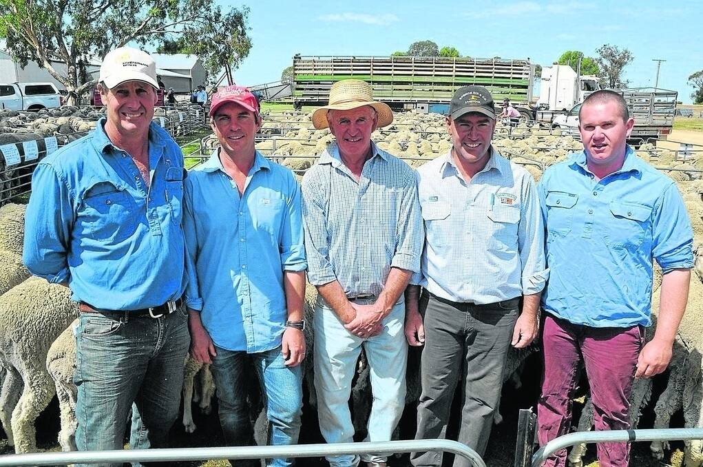 END OF ERA: Cousins Merino Services’ Paul Cousins, Burra, paid to the $250 top at the Blue Hills dispersal sale for a pen of 2013-drop Merino ewes for Martins Well Station, via Yunta. He is pictured with Blue Hills vendors Sam, Jim and Jock Thring and their agent Spence Dix & Co’s Rodney Dix (second from right).