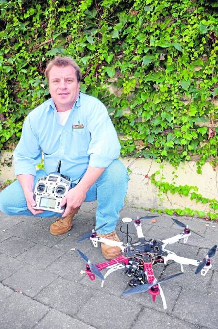Leighton Pearce with an unmanned aerial vehicle.