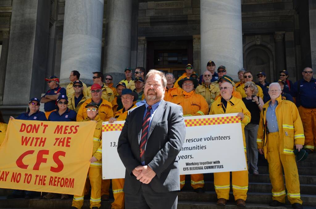 CFS Volunteer Association president Roger Flavell at a rally protesting the government's sector reforms and increases to the ESL. 