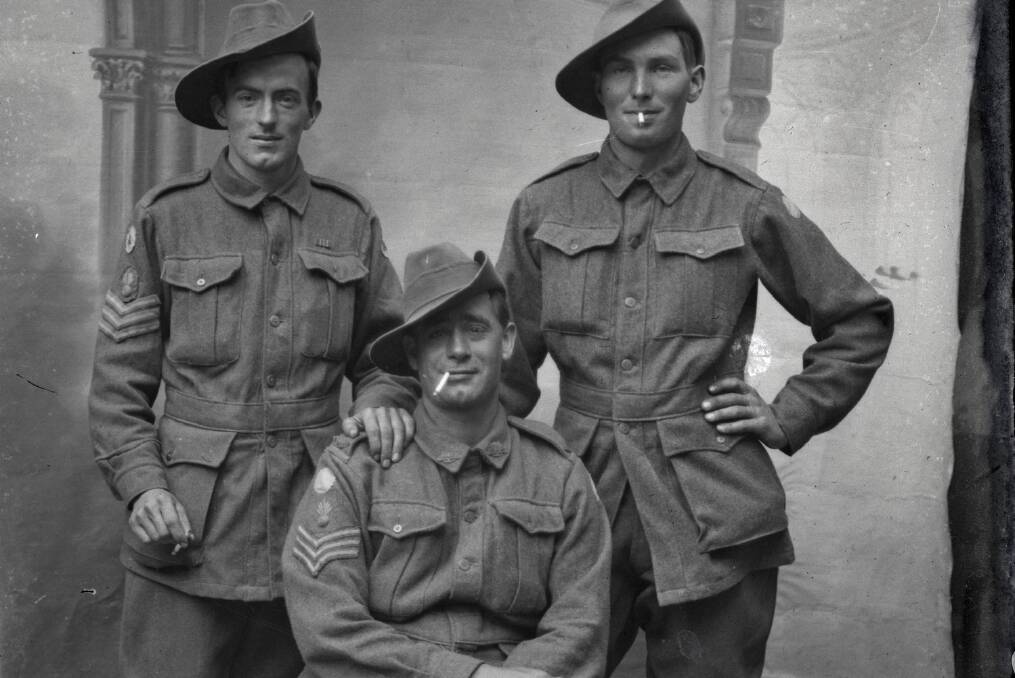 This is a group portrait of three members of the 13th Light Trench Mortar Battery. Cpl Robert Chaffey Stuart MSM is on the far right. The soldier on the left is possibly Sgt Charles Thompson MM+ bar from Northam WA. The name of the seated digger is unknown. Photo: Kerry Stokes Collection