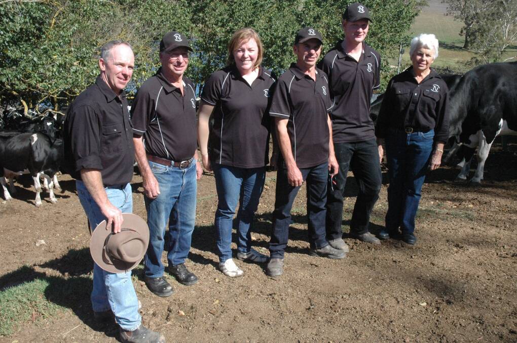 Ian, Meredith and Gavin Newman, worker Leroy Ricks, Kangarilla, and Elaine and David Newman, Meadows, with some of their Holsteins.