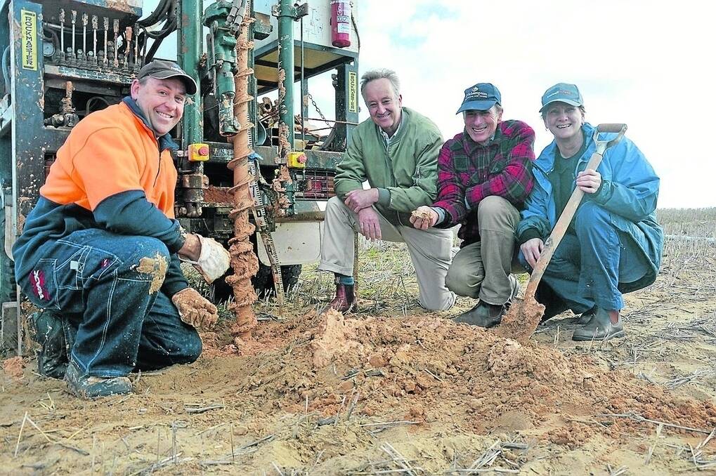 Drill operator Simon Knowles, soil scientist James Hall, groundwater expert Chris Henschke and NRM SAMBD team leader – land management Bernadette Lawson examine the results of sandhill drilling at Mannum.