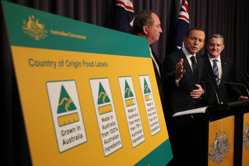 Prime Minister Tony Abbott, Agriculture Minister Barnaby Joyce and Industry Minister Ian Macfarlane announce the new labels. Photo: Andrew Meares