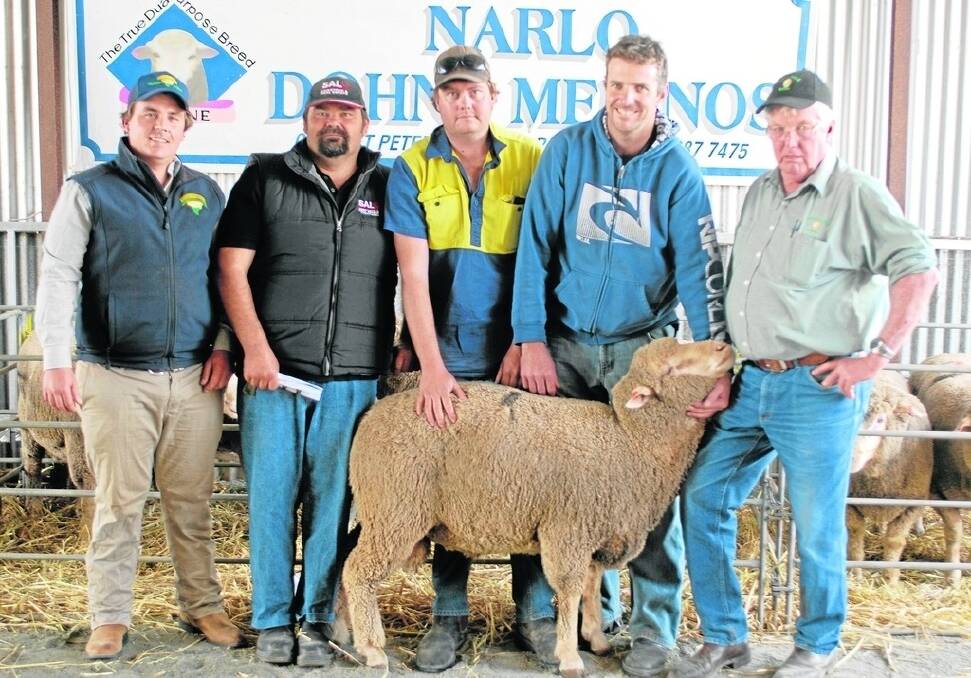 CLASSY LAST: Narlo Dohnes’ final stud ram offering featured this $2100 top-price sire shown by EP Livestock’s  Ben Dickenson; SAL Lock’s Warren Brown; top-ram buyer Wayne Hodge, GW&PJ Hodge, Lock; and Narlo Dohne stud principals Craig and Peter Meaney.