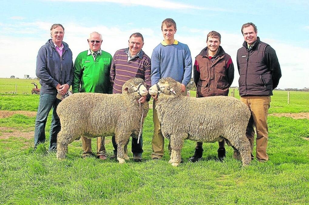 With the two top-price rams at the Callowie sale are Keith Nutt, Orroroo, buyer of the ram on the left at the $2200 second top-price, Landmark Bordertown’s Graeme Hampel, Callowie’s Richard and Angus Halliday, Matthew Wagenknecht with his $2300 top-price ram and Landmark auctioneer Richard Miller.