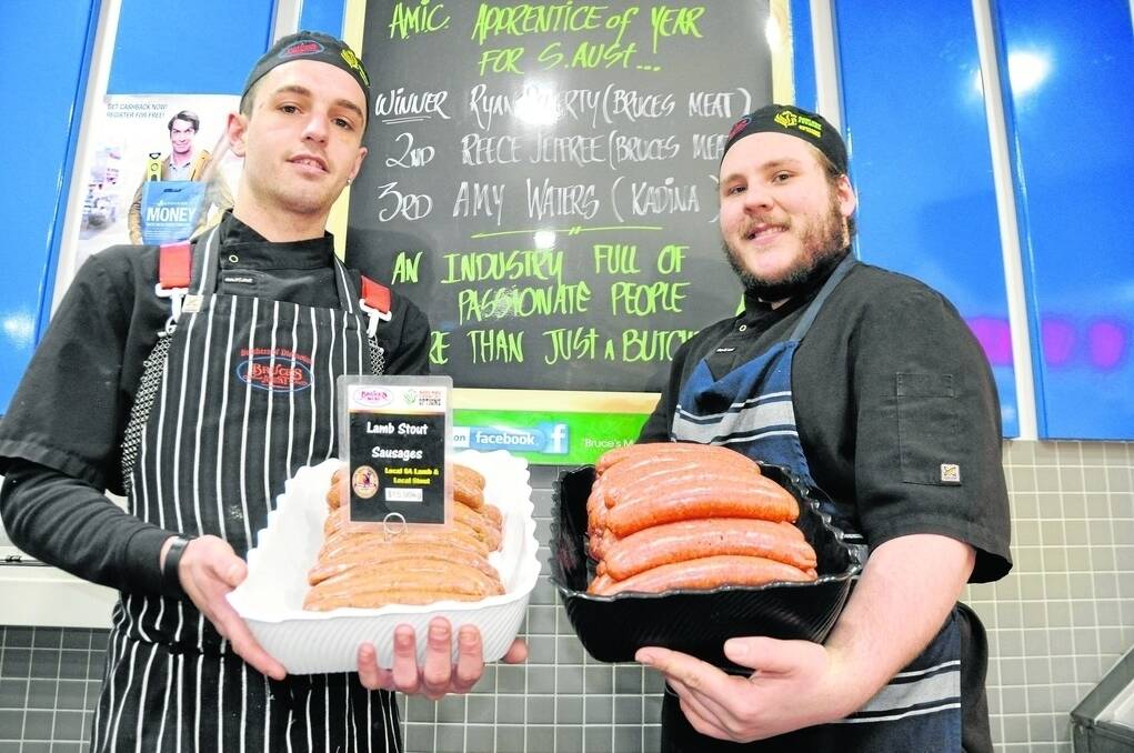 AMIC Apprentice of the Year Ryan Doherty and runner-up Reece Jeffree, both from Bruce’s Meat at Mitcham, with the shop’s award-winning Lamb Stout sausages made from local lamb and Clare Valley Brewing Company stout.