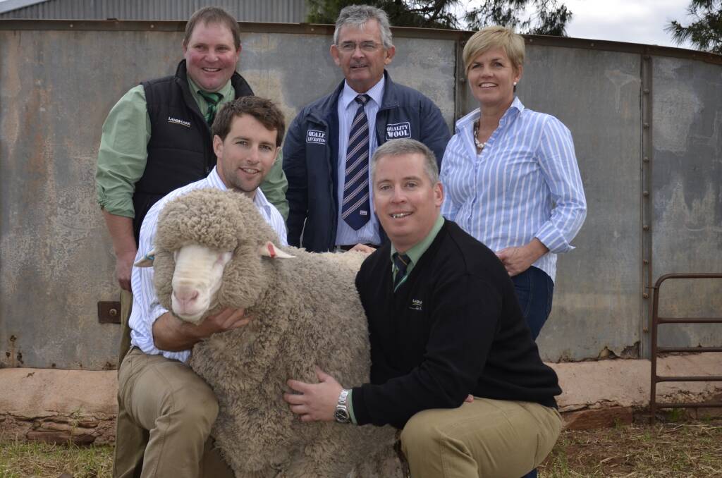  Holding the top-price $8000 ram at Karawatha Park Poll Merino and Merino sale at Buckleboo on Friday is the stud’s Dion Woolford and Landmark SA stud stock manager Gordon Wood. They are pictured with Landmark’s Damien Jericho, Quality Livestock’s Phil Arcus and Karawatha Park’s Barb Woolford.