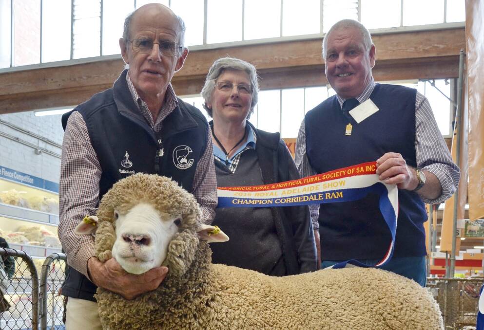 Graham and Di Jenke, Wattle Glen, Strathalbyn, with judge Geoff Risbey, Stanbury, Camperdown, Vic, and their grand champion Corriedale ram.