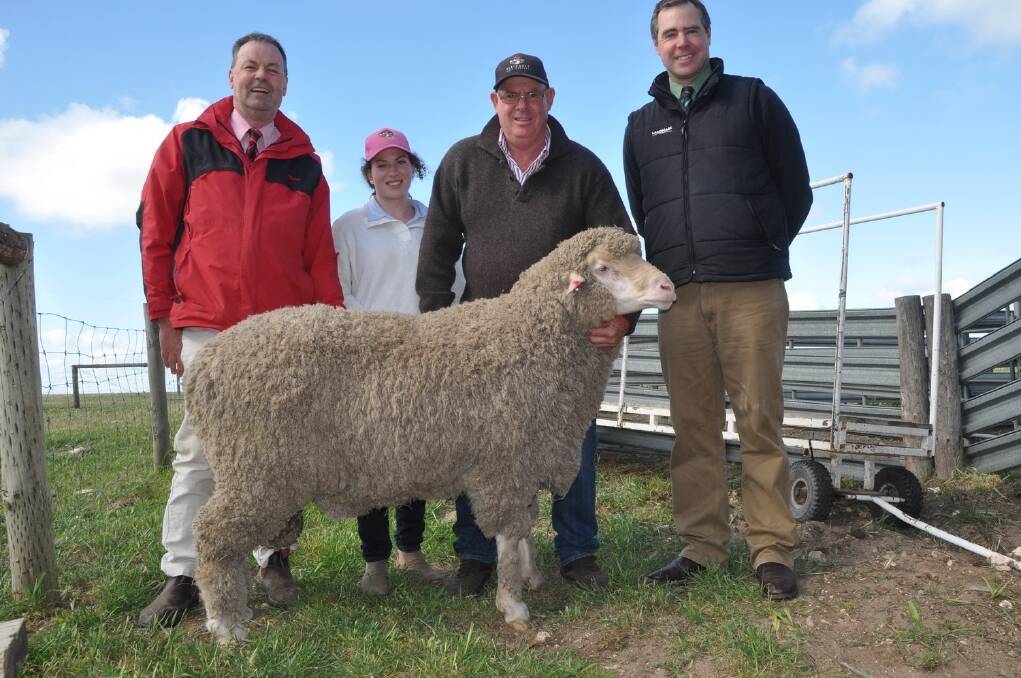 TOP PRICE: Elders Murray Bridge branch manager Phil Nagel, Demi and Wayne Lehmann, Flairdale stud, Cookes Plains and Landmark stud stock auctioneer Richard Miller with the $5400 top-price ram which sold to Jeff Burgess, Gulnare.