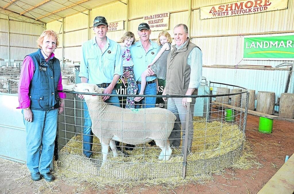 Celebrating a fantastic sale result are Ashmore White Suffolks’ Rhonda Fischer, her son Troy and her husband Brian – holding his granddaughters Isabelle, 7, and Indigo, 4 – and volume buyer Mark Dyson, Springmount, Hindmarsh Tiers. This ram went at $2000 to Mr Dyson, with the proceeds donated by the Fischers to the Ronald McDonald House charity.