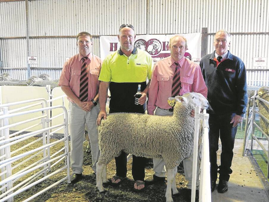 Elders stud stock manager and auctioneer Tony Wetherall with Mike Nicholls, who bought the three $1650 top price Border Leicester rams, Elders’ Greg Downing and Hanookra stud principal Rodney Willmott.