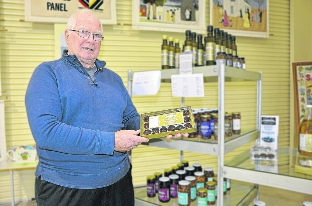 Windy Hill Olives’ Brian Milner, Tumby Bay, with the chocolate-covered olives he is known for.