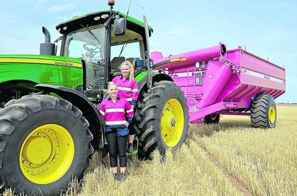 Cleve farmer Ben Ranford’s twin daughters Phoebe and Jade Ranford with their dad’s eye-catching pink chaser bin.