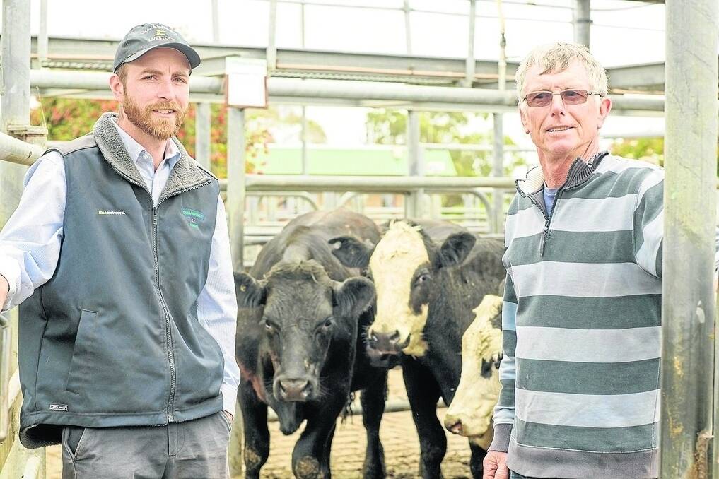 Agent Tim Merrett, Chay & Merrett, Millicent, and Graham Watson, Sheringa, Furner, at Mount Gambier. Mr Watson recently sold his Furner property, and dispersed his cattle herd on Friday, returning a top of $1580 for nine EU-accredited Woonallee-blood Simmental-Angus steers 12-14 months, 483kg, at $1580 or $3.27/kg.