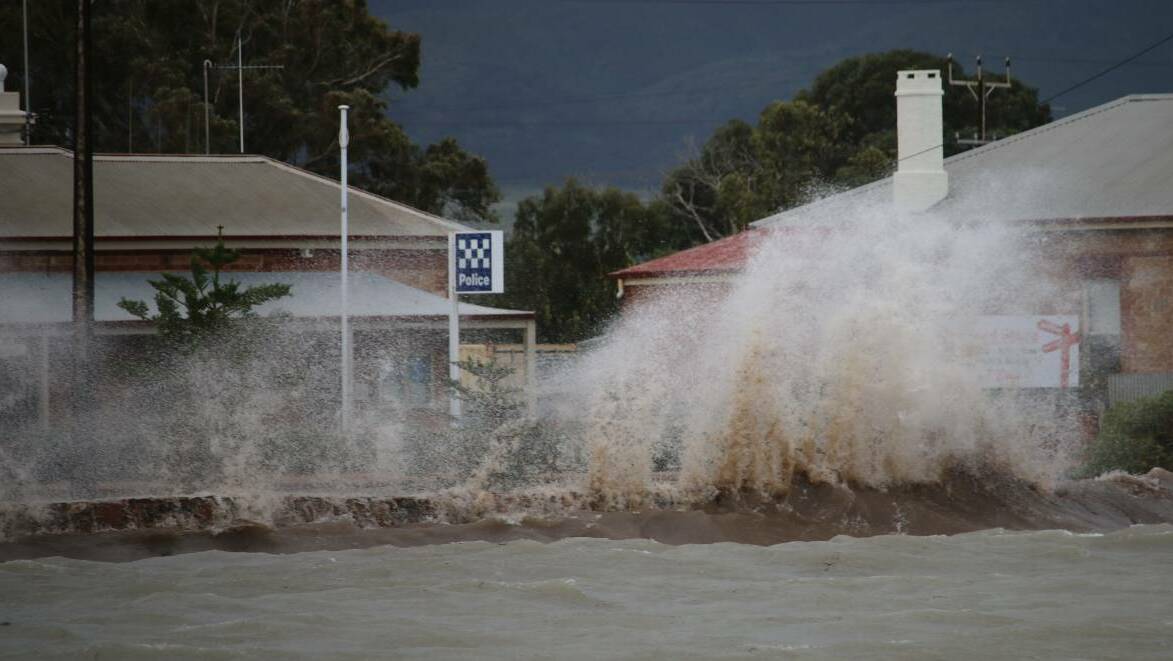 SMASH: A wave smashes into the retaining wall at Port Germein.