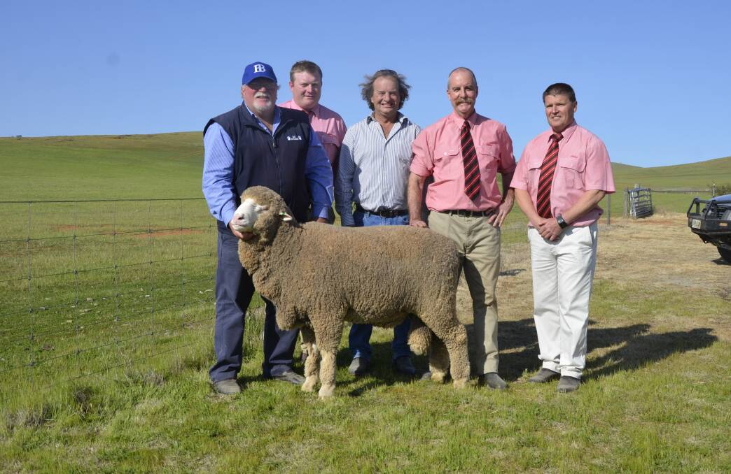 SALE-TOPPER: East Bungaree's Mark Brooks with Elders' Conor Lamond, sheep classer Courtney Sutherland, and Elders' Tom Penna and Tony Wetherall.