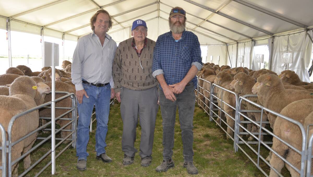 LOYAL BUYERS: Sheep classer Courtney Sutherland with long-time buyer Ivan Fiegert, Edillilie, and his son Fred.