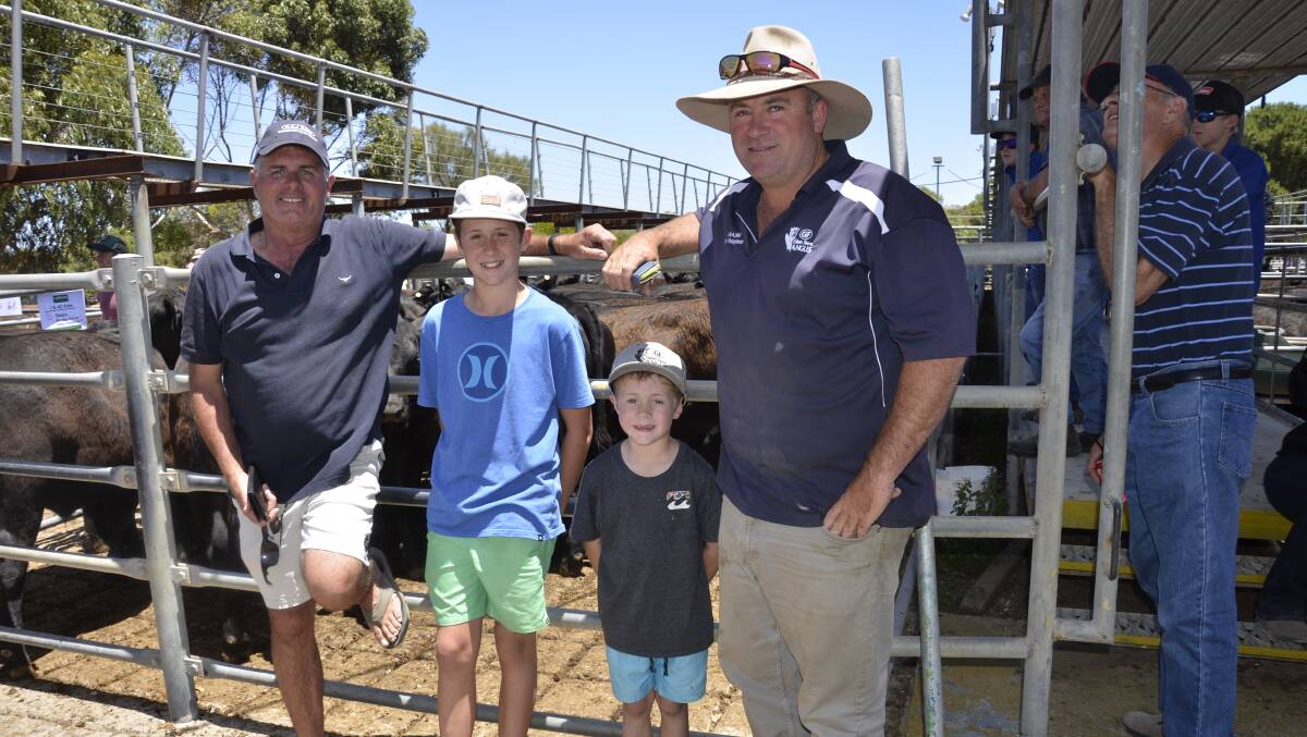 Strathalbyn farmer Ian Kittel, with his sons Charlie, 6, and Henry, 12, and his farm manager Gregg Nash.