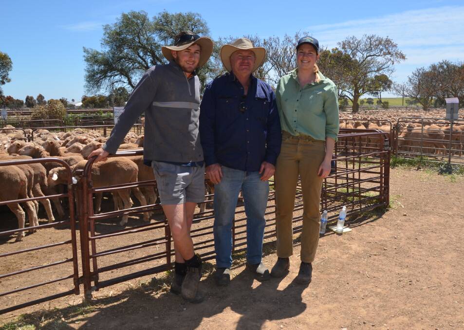 FOND FAREWELL: Son and father Mitchell and Wayne Vanstone, Port Pirie, wished Landmark's Holly Hannaford a fond farewell at her last Jamestown market as she is heading to Lucindale.