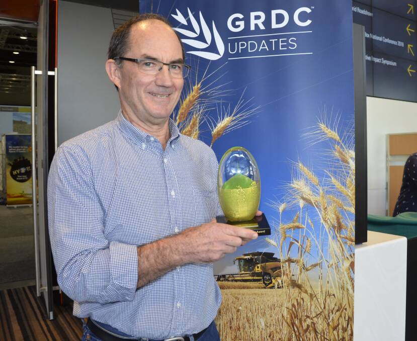 SOIL STUDIES: SARDI soil biology and molecular diagnostics group leader Alan McKay with the Seed of Light awarded at a GRDC update.