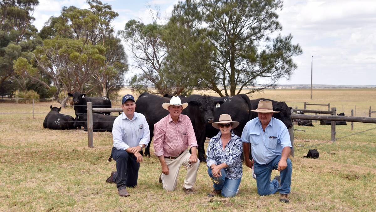 Spence Dix & Co's Mark O'Leary with Lancaster stud principal Tim Cartledge and purchasers of the $15,000 top price bull Robyn and Steve White, Roma, Qld.