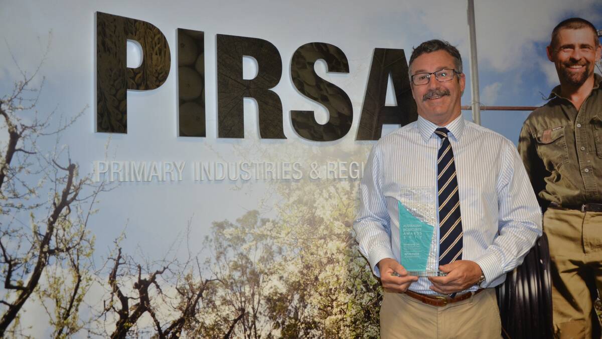 Biosecurity SA executive director Will Zacharin with the Australian Biosecurity Award the department won last week in Canberra.