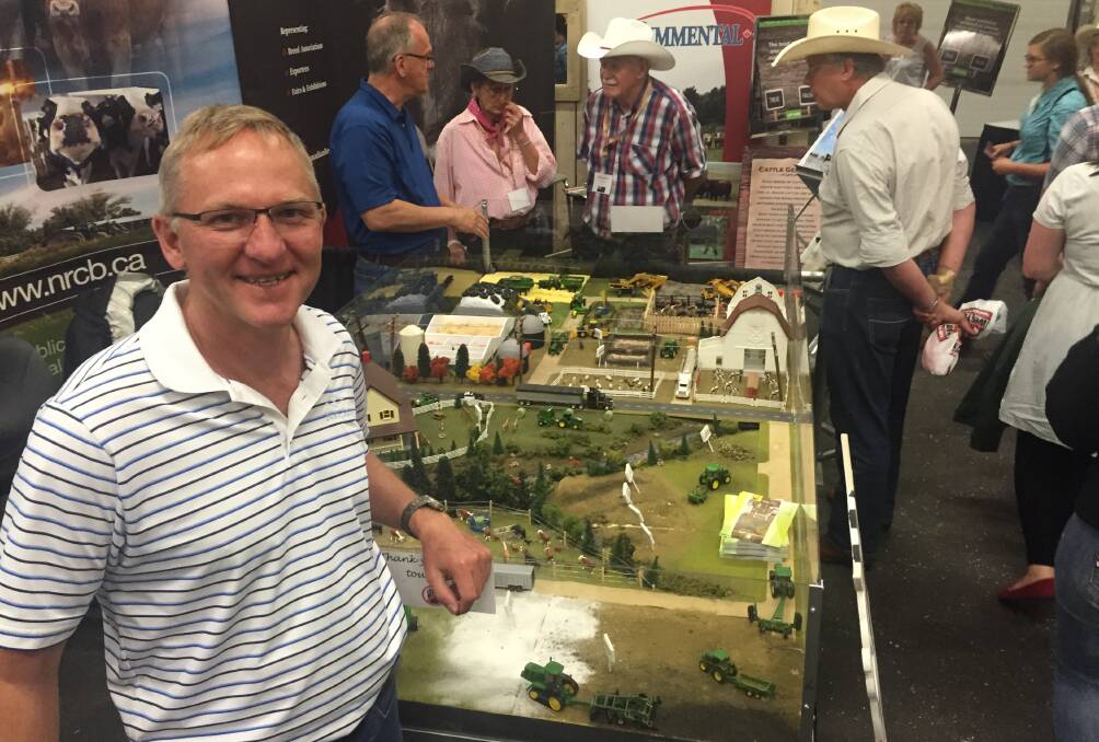 Natural Resources Conservation Board director of field services Andy Cumming showing off a model Canadian farm.