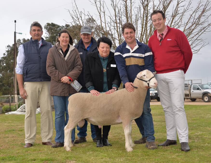 CHARITABLE LOT: SAL auctioneer Laryn Gogel, buyers Leanne and Kym Krause, Western Flat, RFDS Bordertown president Grid Hubl, Bundara Downs co-principal Greg Funke and Elders auctioneer Ronnie Dix with the Krauses' $1800 ram. Proceeds from the sale of the White Suffolk, offered at lot 19, were donated to the RFDS.