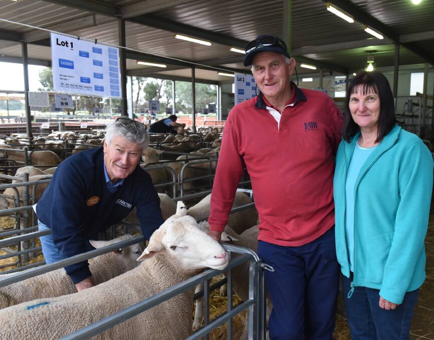 CARCASE SIZE: Leahcim stud principal Andrew Michael with commercial sheep growers Paul and Yvonne Wurst, Appila, who bought the $6000 top price ram at the Snowtown stud's White Suffolk sale on Friday.