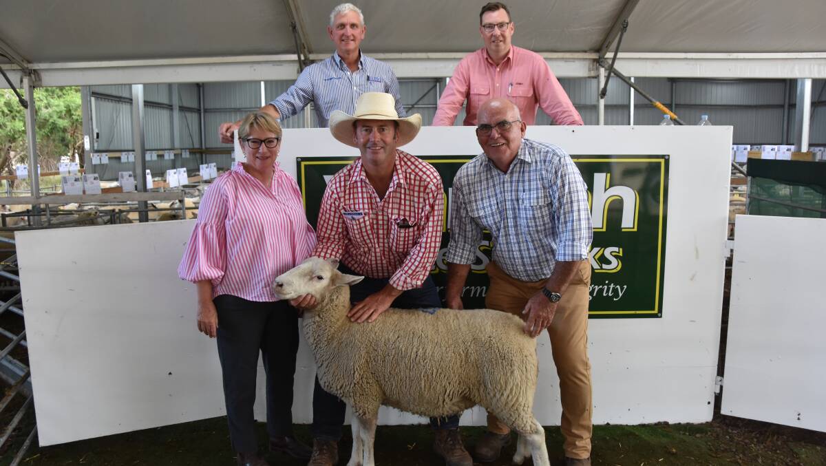 GREAT SALE: Waratah White Suffolk stud principals Debbie and Steve Milne, with the top-priced ewe, Lot 47, 200556, sold to Lachy Day, Days Whiteface, Bordertown, SA, Elders Victoria/Riverina stud stock manager Ross Milne and LMB auctioneer Bernie Grant.