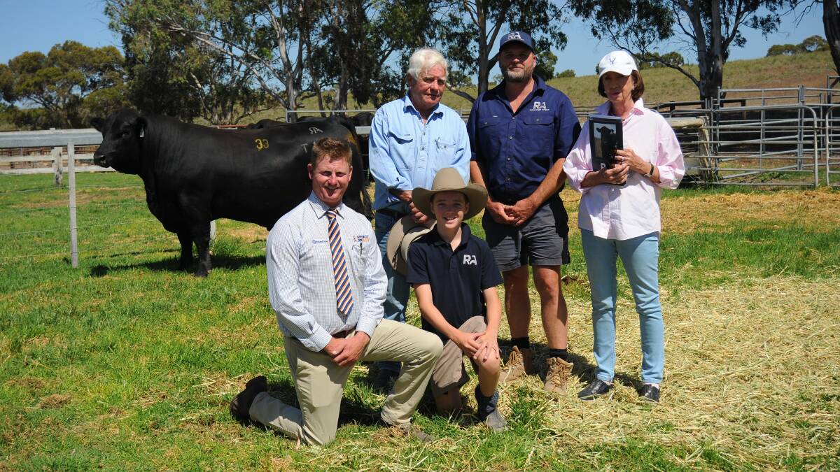 Roseleigh Angus' Nate and Mat Cowley and Spence Dix & Co's Simon Lehmann with buyers Don and Liz Cossart, Dilbong Pastoral Company, Tara, QLD, and sale-topper Roseleigh Taylor T112. Picture by Katie Jackson