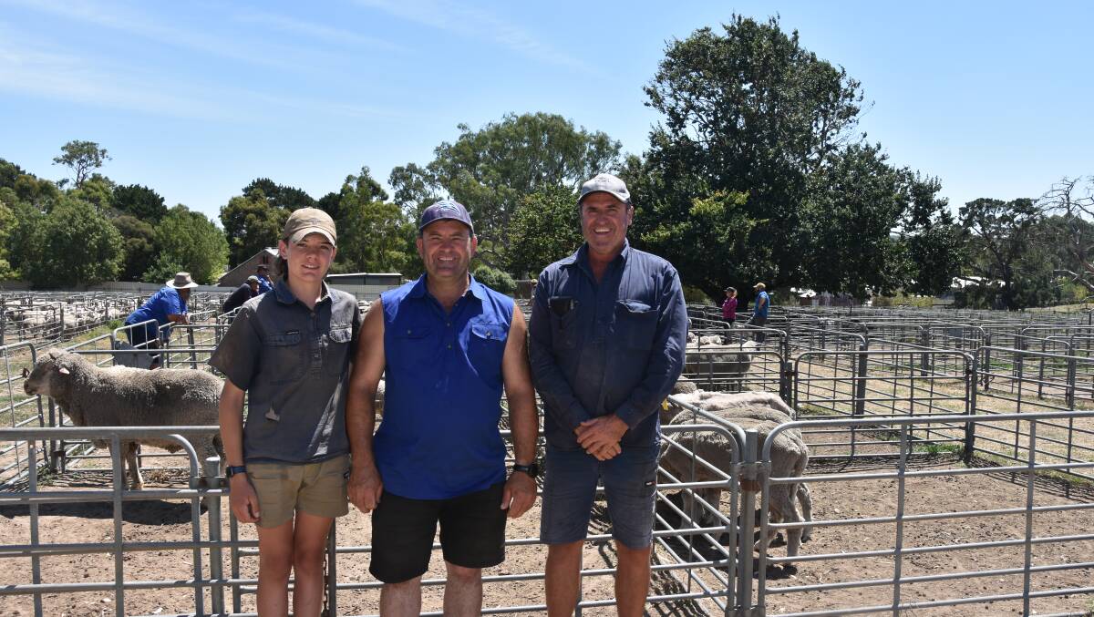 Hudson Waechter, 15, Dale Waechter, Moculta, keeping an eye out for some sheep to buy, with Malcolm Waechter, Nidottie, who was at the sale to observe. 