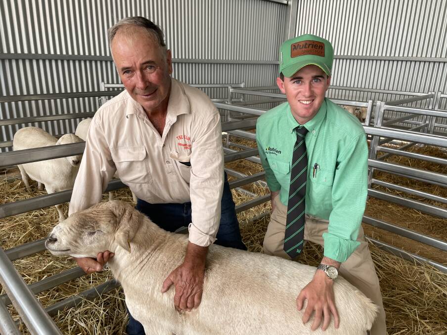 Phil Thompson, The Cliffs, with Nutrien stud stock auctioneer Matt Campion and the top priced ram, which sold for $4200 to WA. Picture by Rebecca Nadge