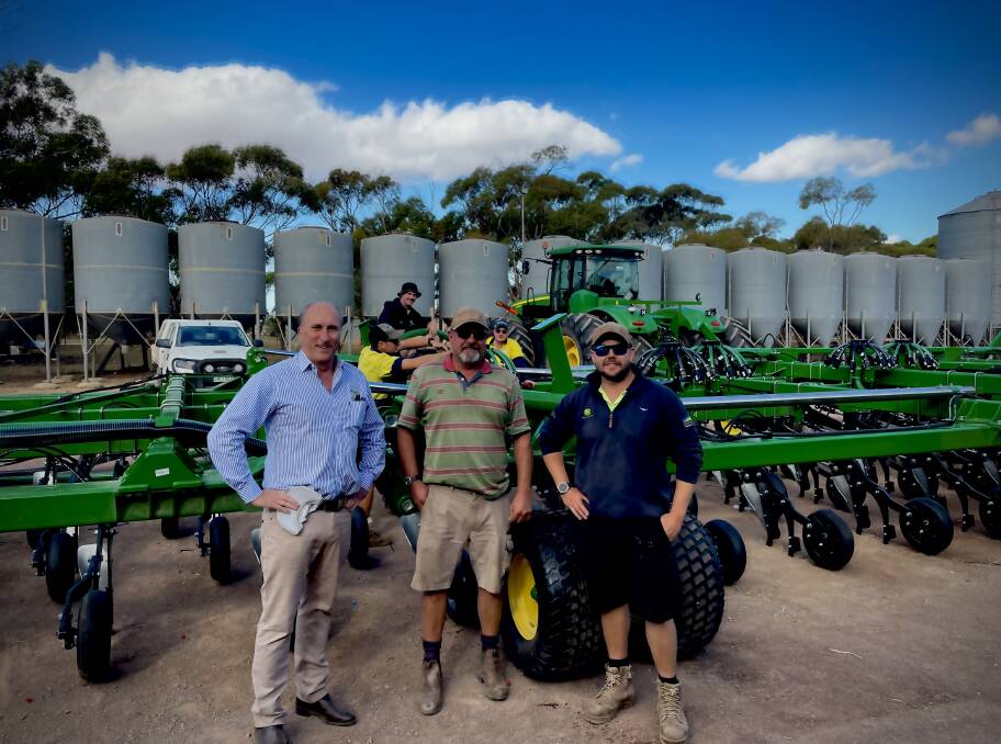 Emmetts director of corporate and customer affairs Andy Emmett with Warburto Farm's Wick Dayman and his son-in-law Nathan Clifford. Picture supplied