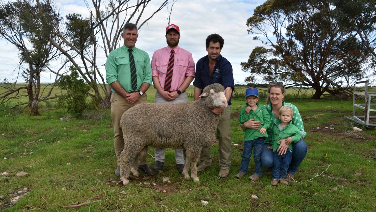 Andrew Wilson, Nutrien and Hayden Biddle, Elders with Flairdale's Matt, Digby and Darcy Lehmann and Elle Watson, pictured with Lot 4, which sold to $7000 through Elders Jamestown. Picture by Conor Lamond 