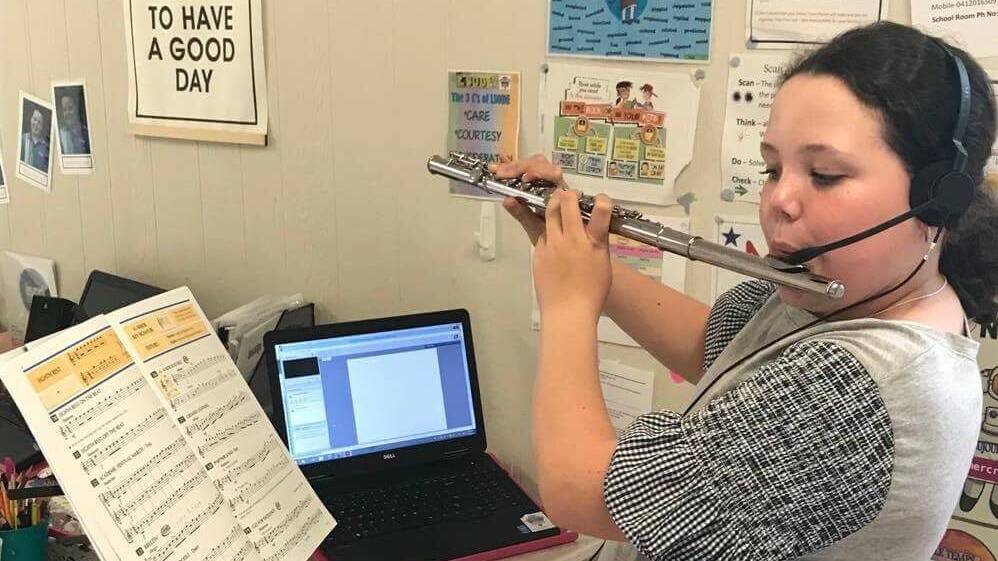Sienna Bettridge, Alpha QLD, carries out her music lesson over the Sky Muster satellite service PHOTO: BIRRR