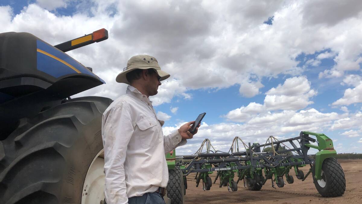 Farmer Tony Single, Narratigah, Coonamble searching for a mobile signal while planting. Photo: Sharon O'Keeffe