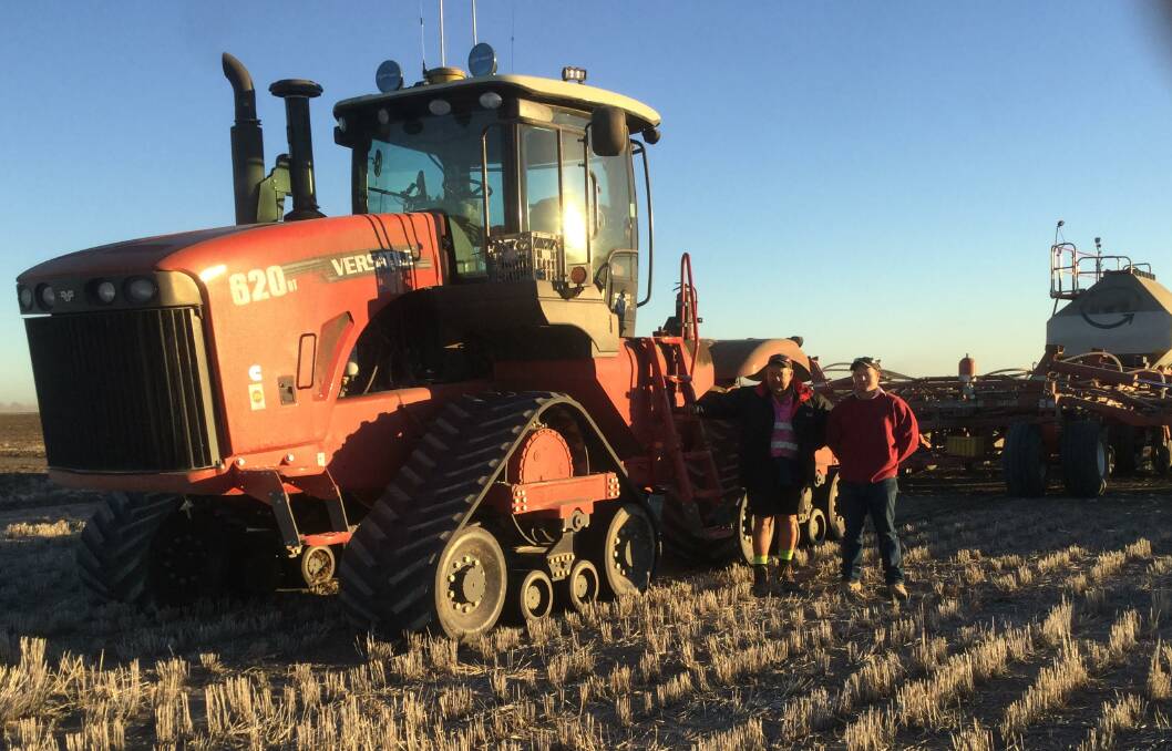 Ian Leader (left) and operator Dean Piper, with one of Leader Contracting's two Versatile 620 Delta tracks pulling Morris 24 metre C2 contour drills sowing chickpeas in tough conditions near Boggabilla, NSW.