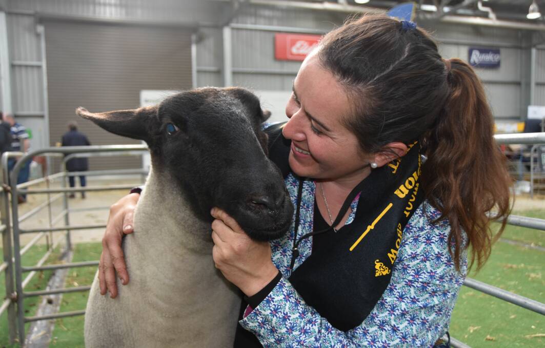 An elated Rachel Chirgwin, Curlew Valley stud, Manoora, with her champion ewe and supreme exhibit.
