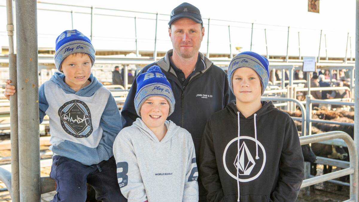 SIZZLING MARKET: John Chay & Co livestock agent Nat Robbins (back), Millicent, with sons Frankie, Levi and Ari at the Mount Gambier store cattle sale earlier this month.