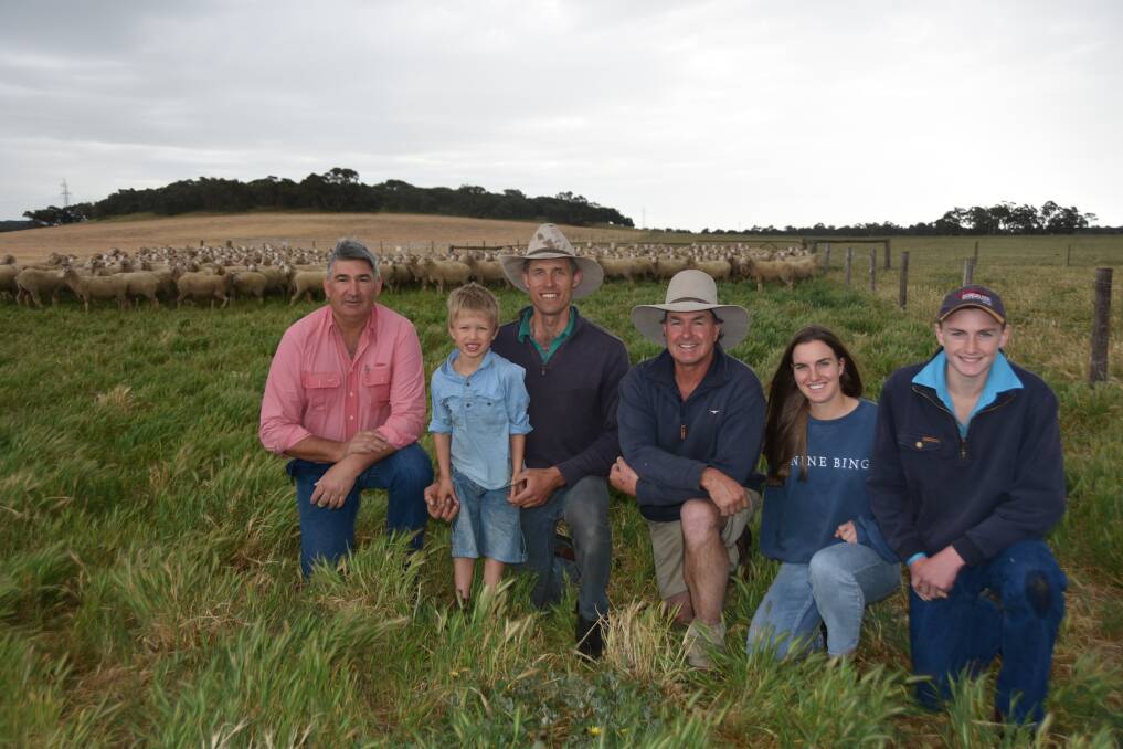 NEW CHAPTER: Elders' Laryn Gogel, Ashrose stud's Tim and Ralph Graetz and new owners Matt, Sophie and Dougal Ashby, North Ashrose, Gulnare with some of the stud's older ewes.
